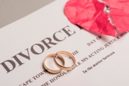 Two wedding rings and divorce file papers